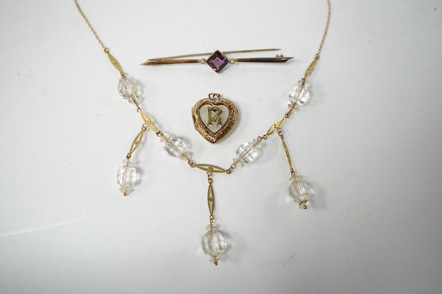 A 9ct and paste set drop pendant necklace, 48cm, a 9ct and amethyst paste set bar brooch and a '9ct back and front' heart shaped locket. Condition - poor to fair